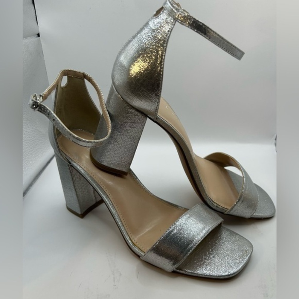 NWOT Kelly & Katie heels.  Shimmering silver metallic. Size 10. Never wo…